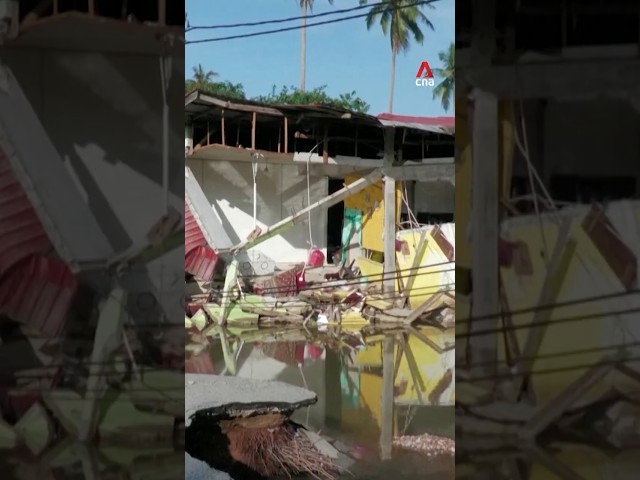 ⁣Malaysian flood victims return to devastated homes