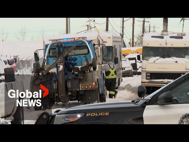 ⁣"They're forcing us out": Calgary police, tow trucks remove RVs from makeshift commun