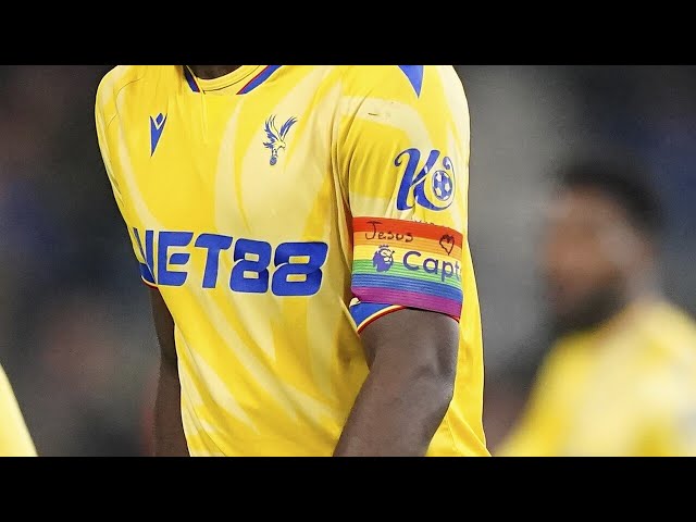 ⁣‘Double standards’: Footballer under fire for religious message on gay pride armband