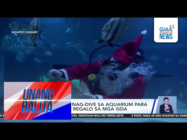 ⁣Santa Claus, nag-dive sa aquarium para magbigay ng regalo sa mga isda | Unang Balita