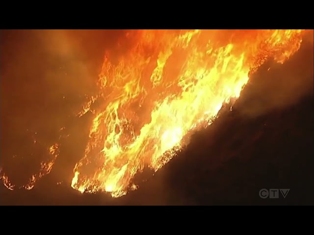 ⁣Aerial view of wildfire spreading in Malibu, California