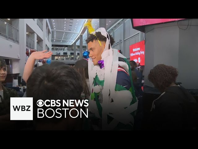 ⁣Patriots players get wrapped up at children's holiday party