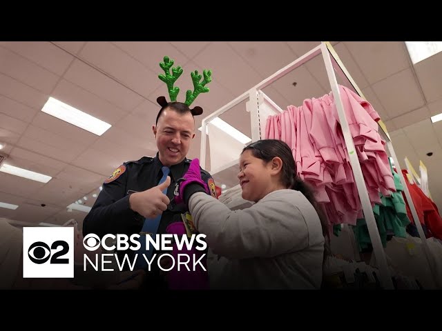 ⁣Nassau County police officers take students on holiday shopping trip