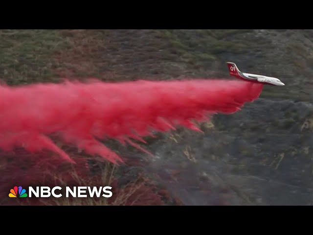 ⁣Crews fight Malibu fire from the air as winds die down