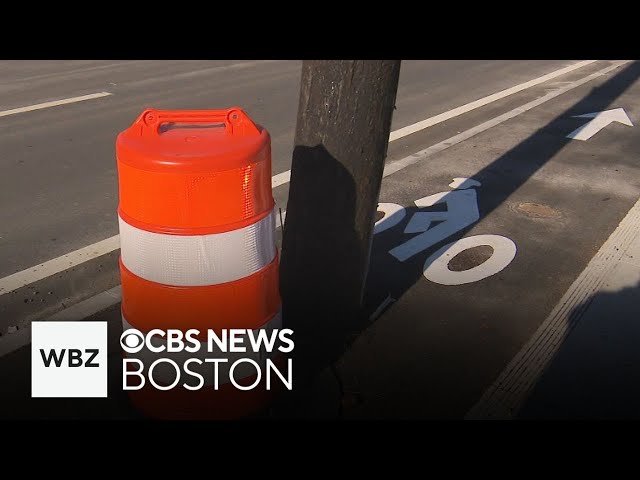 ⁣New Newton bike lane blocked by utility poles