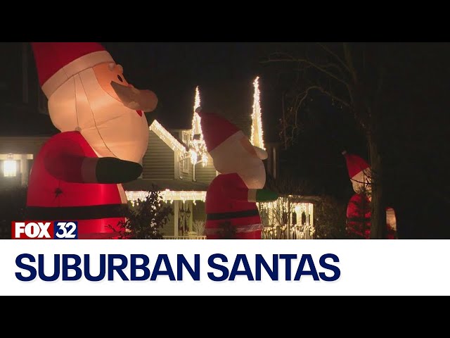 ⁣Suburban street lined with inflatable Santas for holiday season