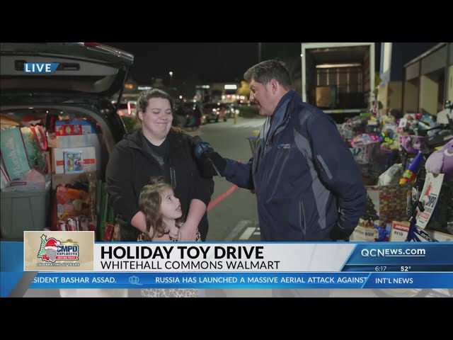 ⁣South Carolina family brings carload of toys to CMPD drive