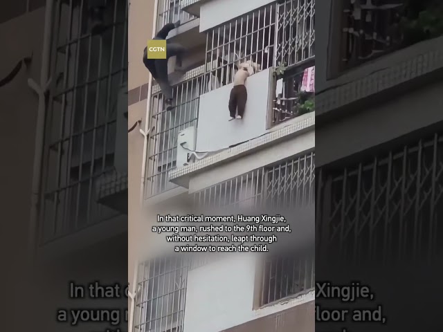 ⁣Man risks life to save child dangling from 8th-floor balcony