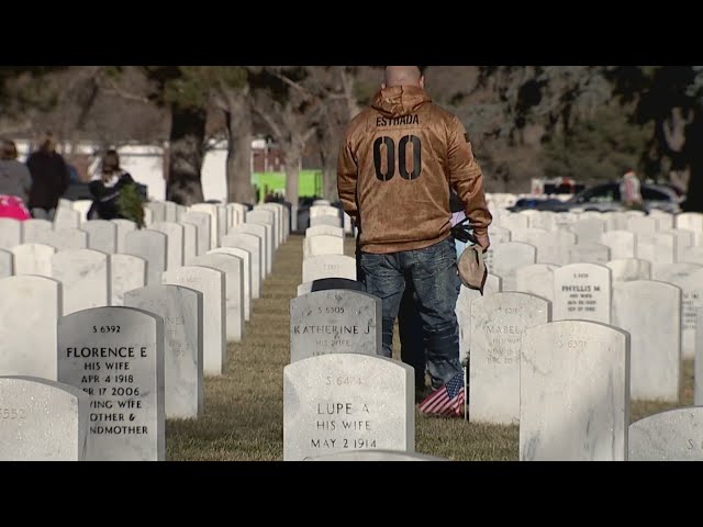 ⁣Wreaths laid on graves at Fort Logan Cemetery