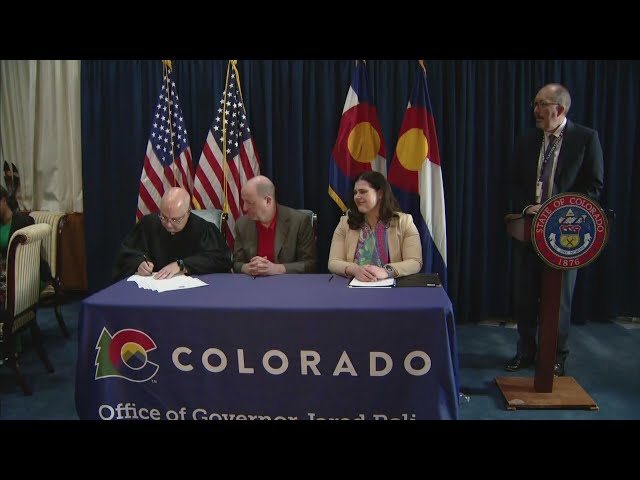 ⁣Gov. Jared Polis watches as Colorado's Presidential Electors cast votes