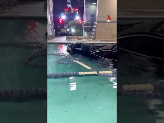 ⁣ Firefighters remove fully submerged car from fitness centre pool