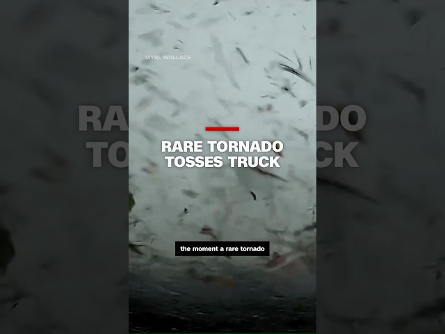 ⁣Truck's dashcam captures the moment a rare tornado hit and tossed it