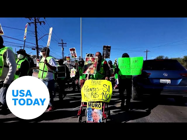 ⁣Migrants, activists protest at US-Mexico border | USA TODAY