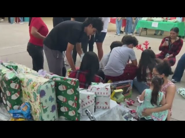 ⁣Coral Reef High School students help "Adopt a Family" for the holidays program