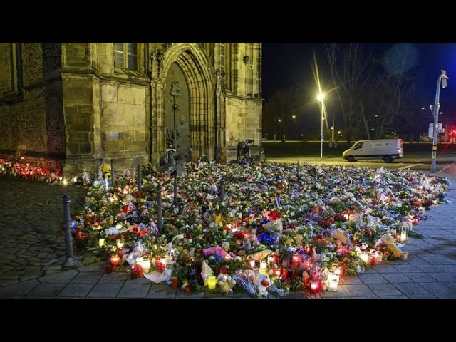 ⁣Candles and flowers flood makeshift memorial for Magdeburg market attack