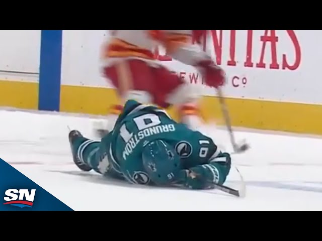 ⁣Flames' Brayden Pachal Drops the Gloves After Massive Hit on Sharks' Mikael Granlund