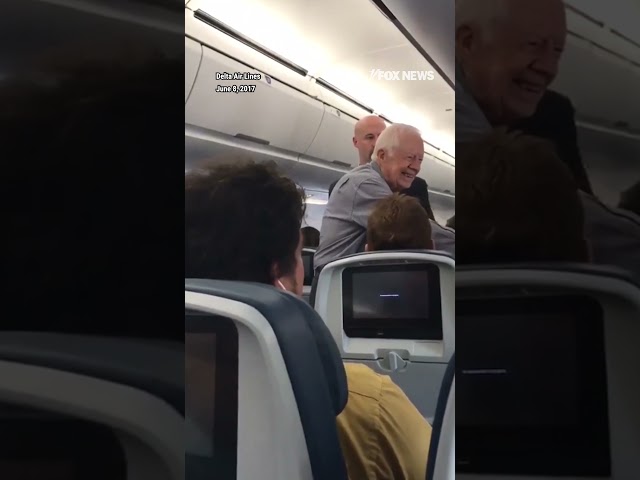 ⁣Flashback: Former President Jimmy Carter shakes hands with every passenger on Delta flight