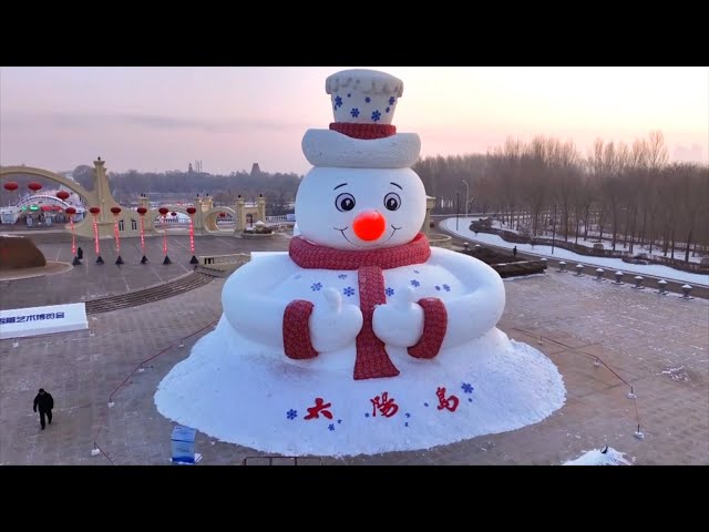 ⁣Snowman dresses up for New Year in NE China's Harbin