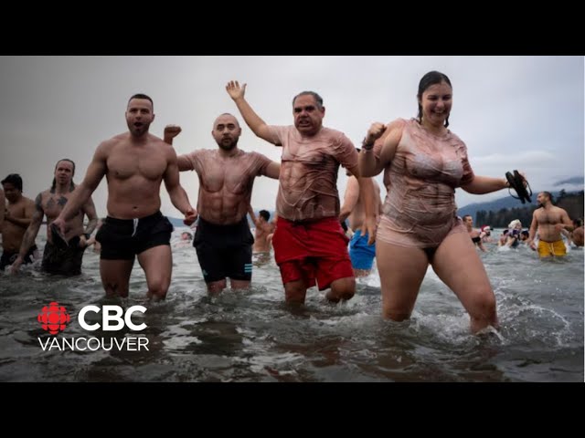 ⁣Thousands take the plunge for Vancouver's traditional Polar Bear Swim