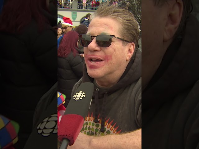 ⁣Thousands take the plunge for Vancouver's traditional Polar Bear Swim