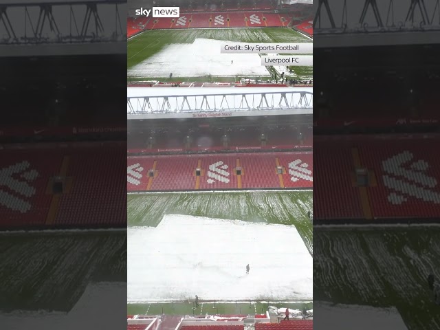 ⁣Snow cleared from Anfield pitch