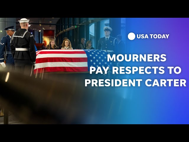 ⁣Mourners pay respects to President Jimmy Carter