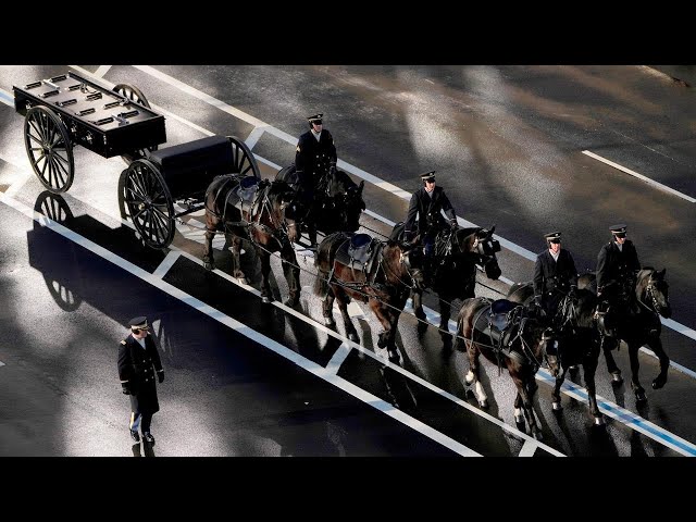 ⁣Jimmy Carter's casket arriving at U.S. Navy Memorial