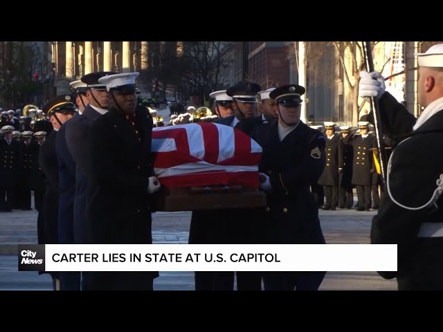 ⁣Jimmy Carter lies in state at U.S. Capitol