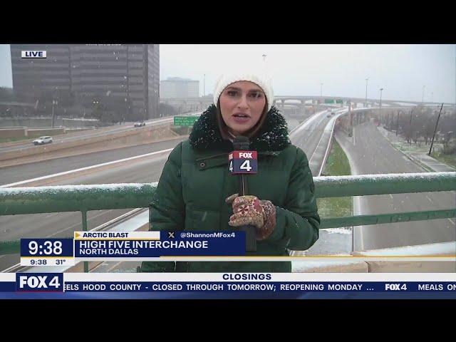 ⁣Snow falls on Dallas High Five Interchange