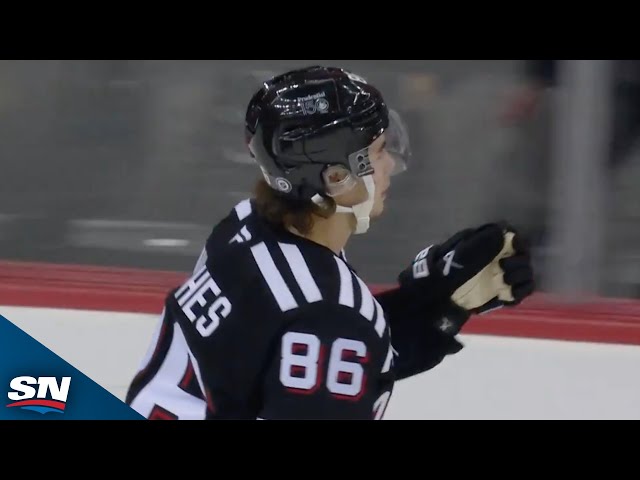 ⁣Devils' Jack Hughes Intercepts Pass Before Wiring Shot Top Corner