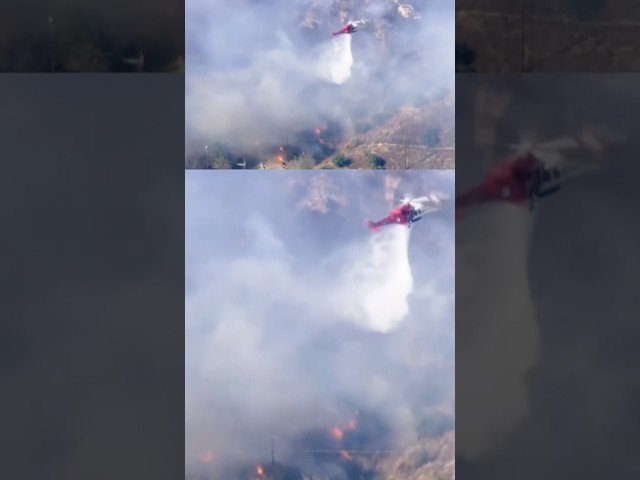 ⁣Footage shows a helicopter dropping water on wildfire #shorts