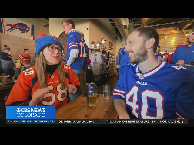 ⁣Colorado couple cheer for opposite teams during Broncos, Bills game