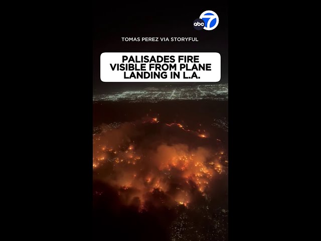 ⁣Palisades Fire visible from plane landing in LA