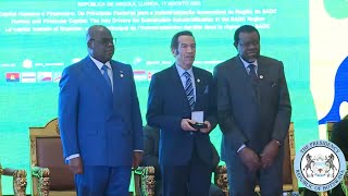 ⁣Ian Khama recieving the SADC founding father award on behalf of his late father