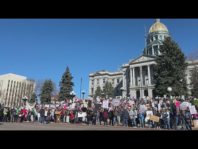 ⁣Thousands protest on International Women's Day at Colorado State Capitol