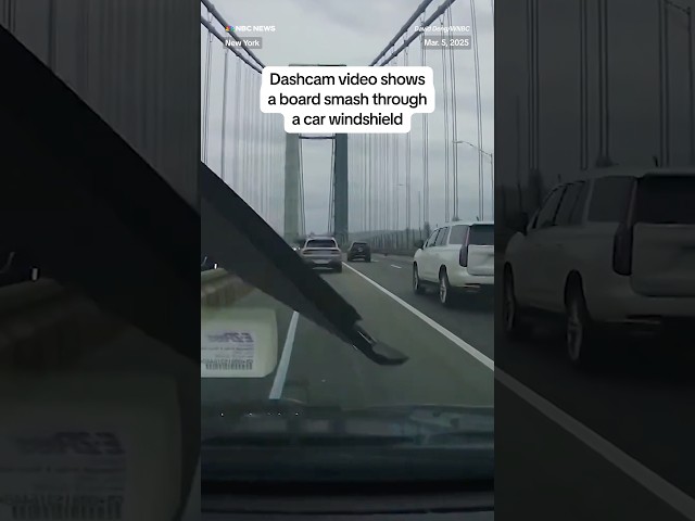 ⁣Dashcam video shows a board smash through a car windshield