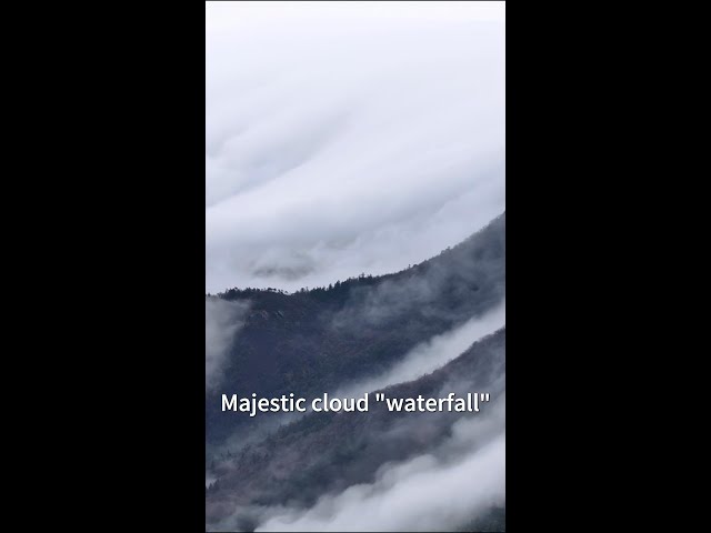 ⁣Majestic clouds cascade over China's Lushan Mountain