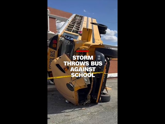 ⁣Severe weather throws school bus up against high school in Alabama