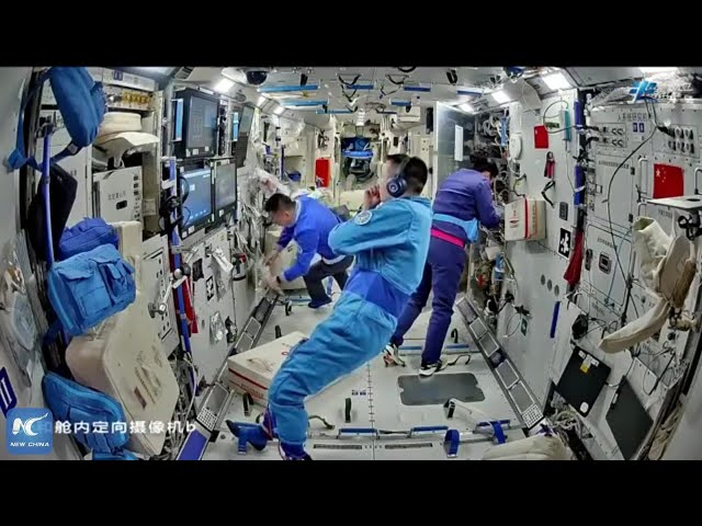 Taikonauts get a fresh trim aboard space station